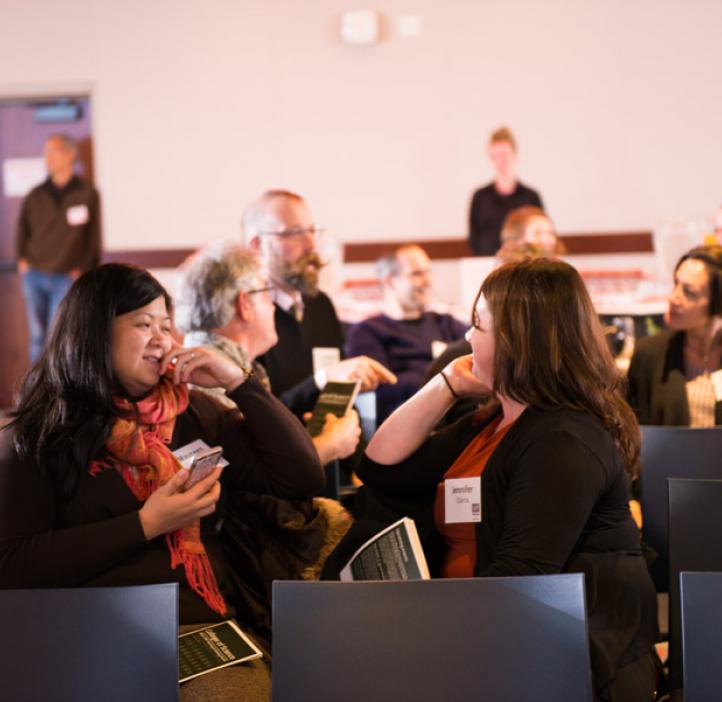 Awards ceremony attendees work together on a problem posed by guest presenters ESTEME