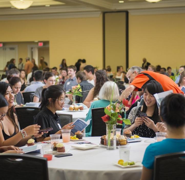 students talking at table