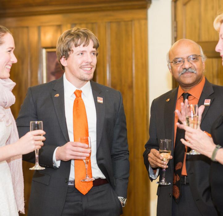 award winners talking with colleagues