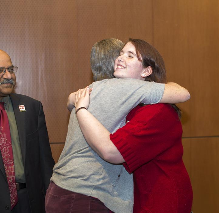 Biochemistry and Biophysics student Stephanie Schulden presents the Olaf Boedtker Award for Excellence in Undergraduate Advising