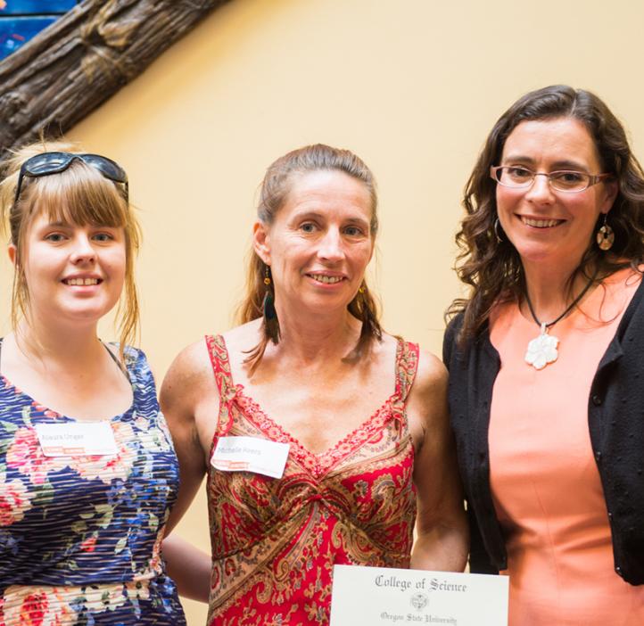 Two scholarship students with Head Advisor Claire Colvin