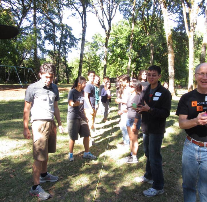 students and faculty setting up water balloons