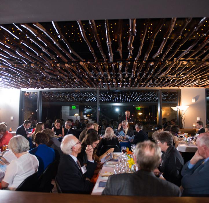 audience sitting at tables