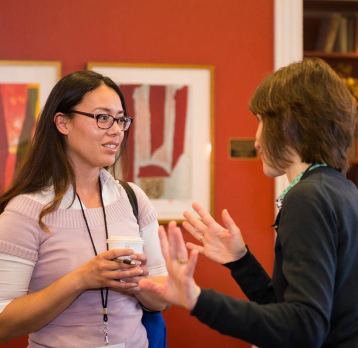 female conference attendees talking in lobby