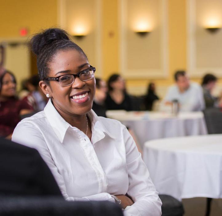 female conference attendees sitting in audience