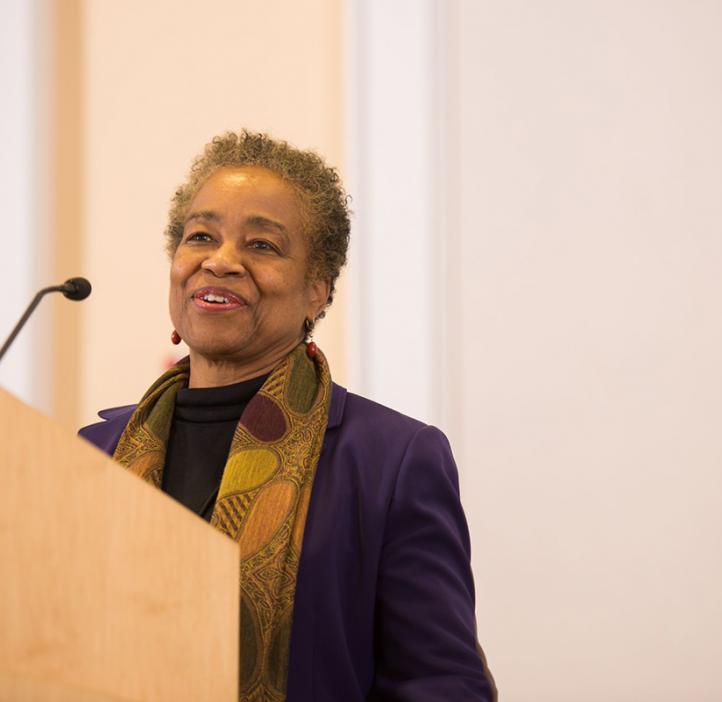 conference speaking to audience from stage