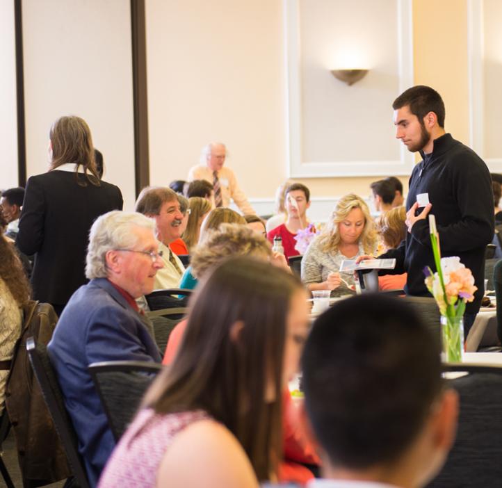 audience talking at tables during reception