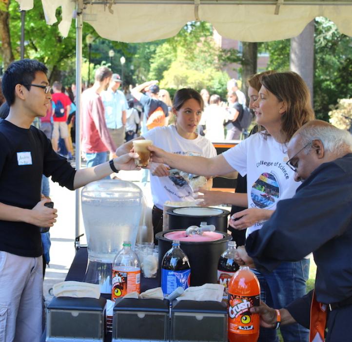 Julie Greenwood giving root beer float to student