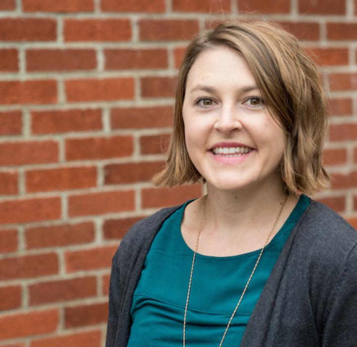Sophie Pierszalowski, Biochemistry & Biophysics, in front of brick wall