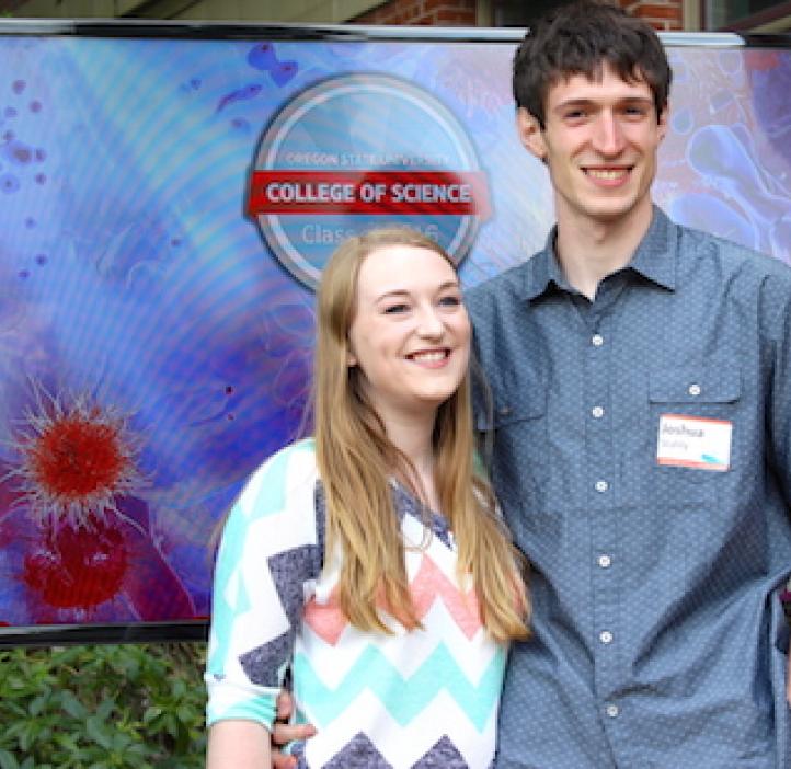 science students in front of backdrop