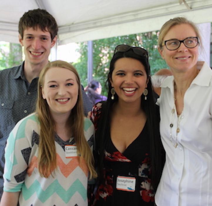 students smiling with mentor