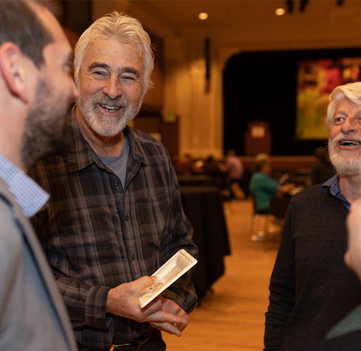 Stephen Giovannoni talking with colleagues