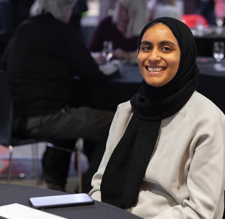 Learning Assistant smiling at the camera