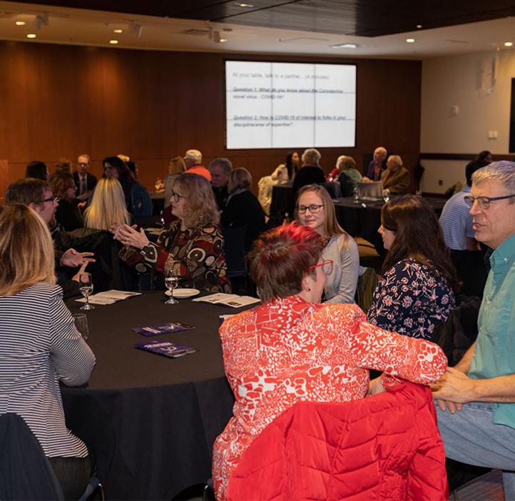 Gabs James and Scott Peterson collaborate during a facilitated discussion demonstrating how learning assistants help in large classrooms