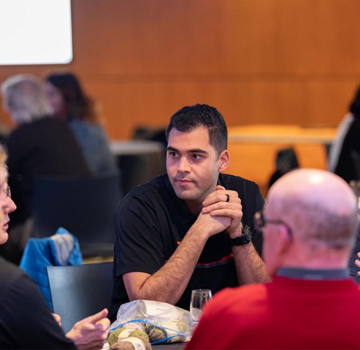 Learning assistants lead a table discussion