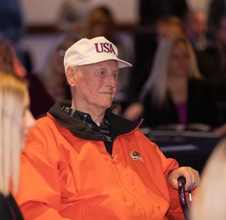 Former head advisor Olaf Boedtker looks on as Alex Beck wins the Boedtker Award for Excellence in Academic Advising, given in his honor