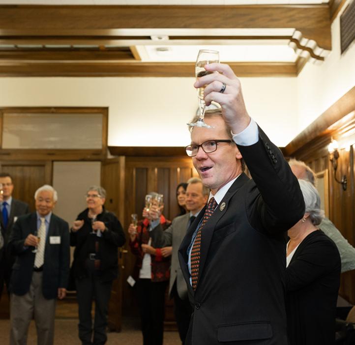 Roy giving a toast at an event