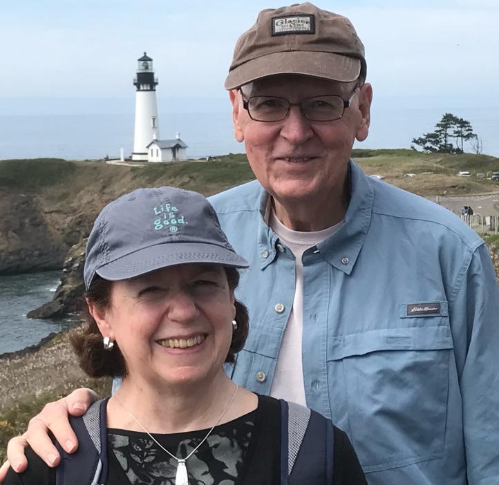 Ron and Ann Berg in front of Yaquina Head Lighthouse in Newport, OR