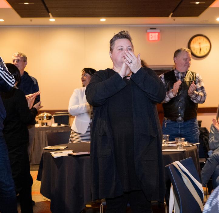 The audience claps and cheers at the 2024 Winter Awards Ceremony at Oregon State University.
