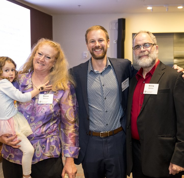 People pose for photo at Alumni Award dinner.