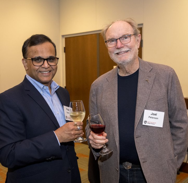 People pose for photo at Alumni Award dinner.
