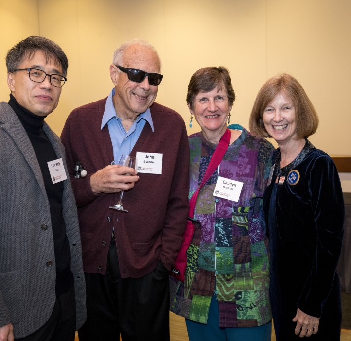 People pose for photo at Alumni Award dinner.