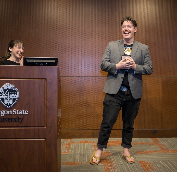 Jessica Siegel presents an award to Eric Cole.