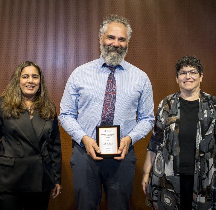 Vrushali Bokil and Eleanor Feingold present an award to Jeff Hazboun.