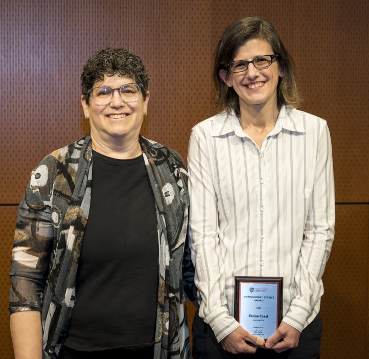 Eleanor Feingold presents an award to Elaine Cozzi. 