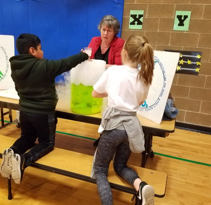 Margie Haak works with elementary students.
