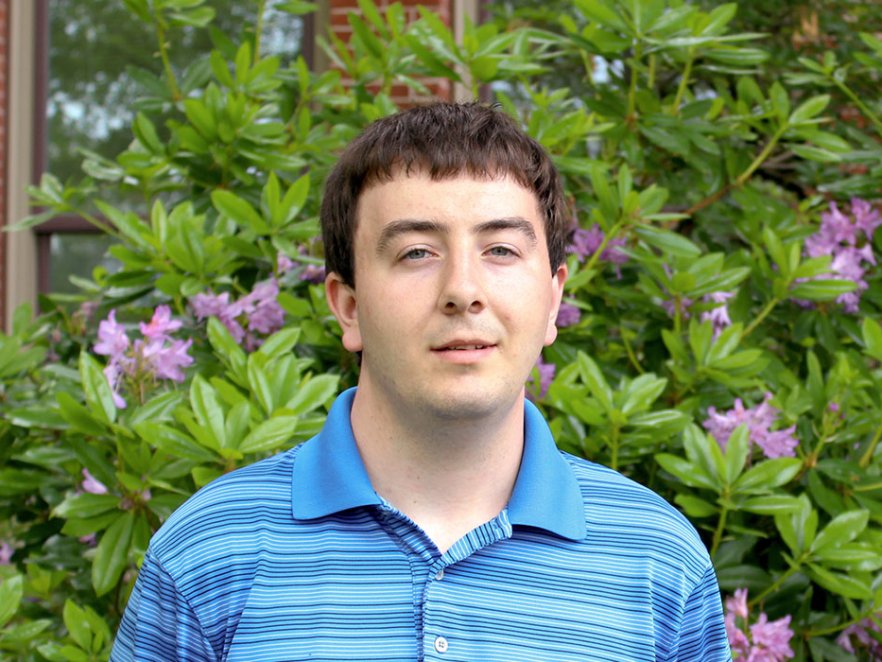 Jonathan Van Why standing outside of Kidder Hall