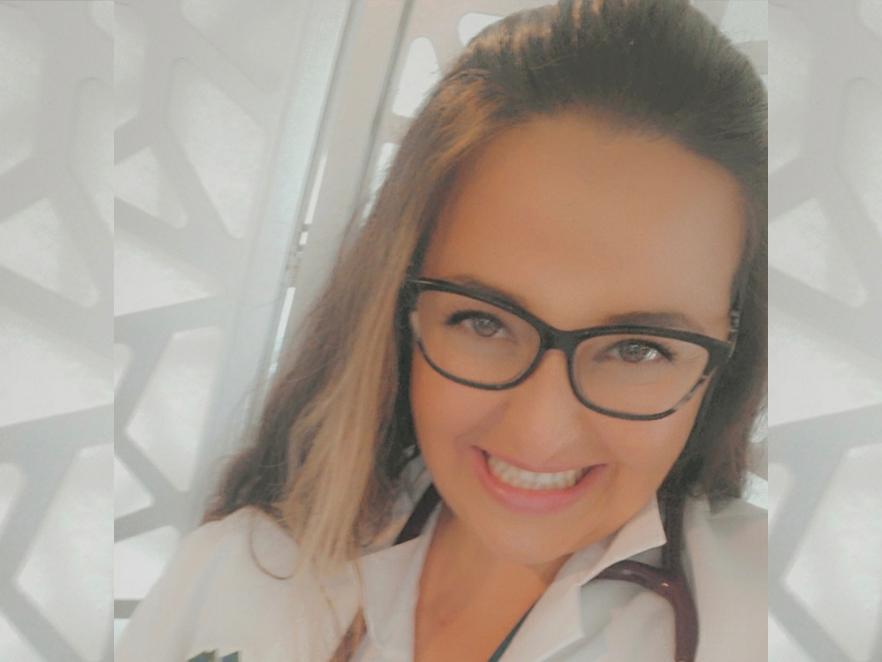 Ashley King, a woman in glasses and a white lab coat.
