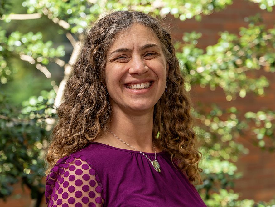 Sarah Henkel smiling headshot on campus