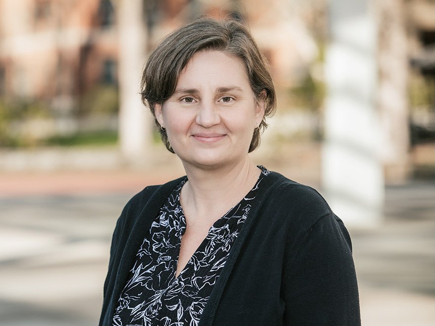 Smiling headshot of Elizabeth Gire on campus