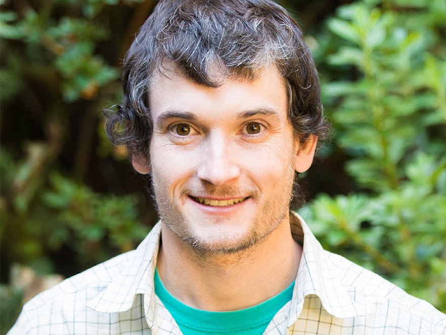 Smiling headshot of Nathan Kirk outdoors